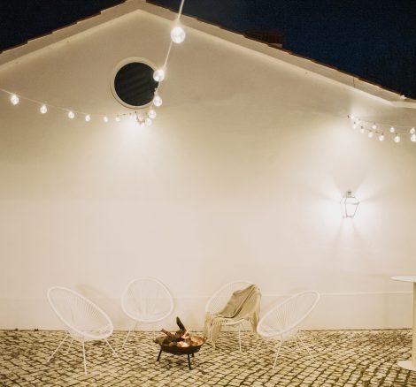fairy lights over the courtyard at wedding venue casa sacoto in portugal