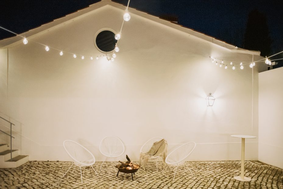fairy lights over the courtyard at wedding venue casa sacoto in portugal