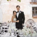 bride and groom stood amongst wedding tables outside at Spanish wedding venue villa catalina