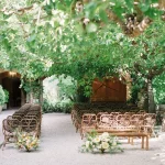 wedding ceremony with wooden chairs outside at Spanish wedding venue villa catalina in Spain near Barcelona