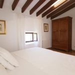 wooden beam ceiling in one of the bedrooms at wedding venue in mallorca san son Andreau
