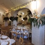 wedding reception tables with wooden rustic chairs at villa Catalina in spain