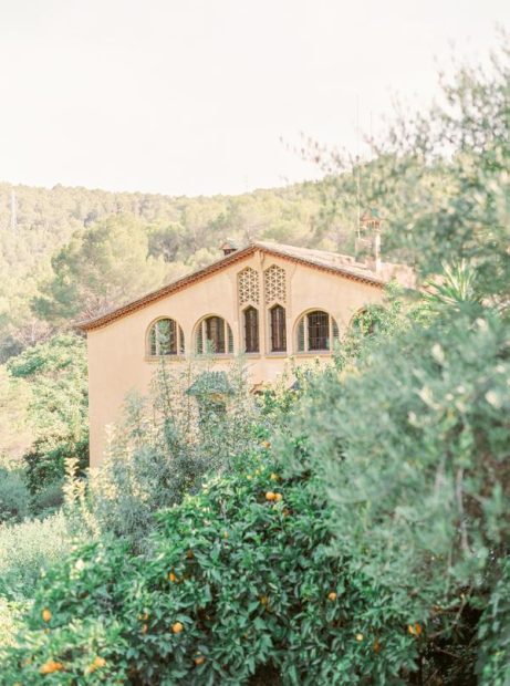 yellow exterior of rustic spanish wedding venue Villa Catalina
