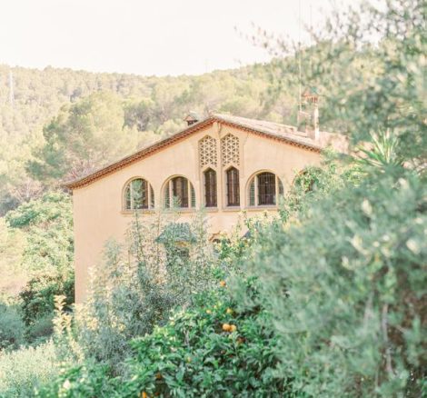 yellow exterior of rustic spanish wedding venue Villa Catalina