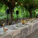 unique clear perspex chairs for a wedding meal outside at villa catalina