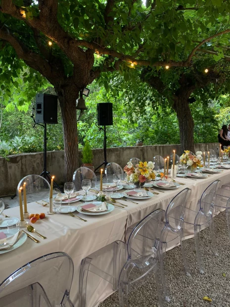 unique clear perspex chairs for a wedding meal outside at villa catalina