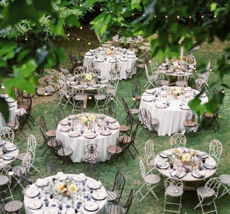 circular wedding tables laid on the lawn at spanish wedding venue Villa Catalina