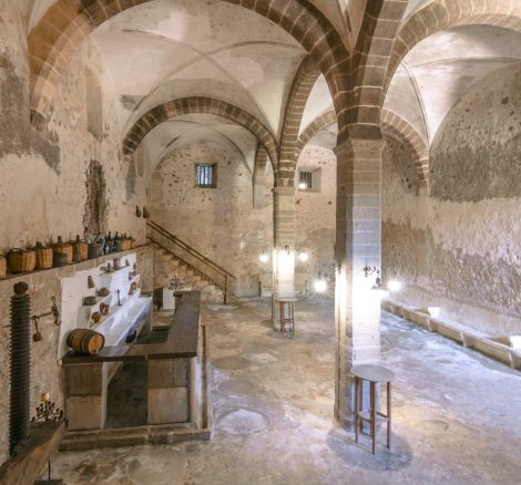 amazing hidden wine cellar with huge stone arched ceilings at mallorca wedding venue Son Sant Andreu