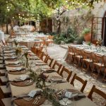 al fresco dining wooden table and chairs at spanish wedding venue Villa Catalina