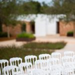 white wedding chairs set up for a wedding at ca na xica wedding venue in ibiza