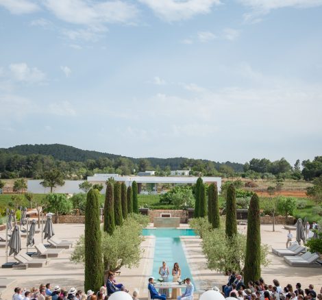 outdoor real wedding ceremony by the t shaped pool at ibiza wedding venue ca na xica