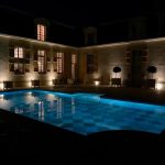 Photograph of the exterior pool area at stunning French wedding venue, Château de Villette