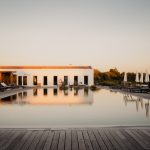 decking alongside pool area outside at craveiral farmhouse in portugal