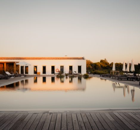 decking alongside pool area outside at craveiral farmhouse in portugal
