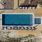 aerial shot directly above the outdoor pool at craveiral farmhouse wedding venue in portugal