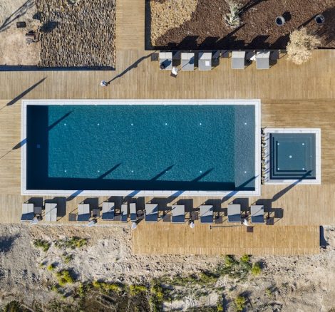 aerial shot directly above the outdoor pool at craveiral farmhouse wedding venue in portugal