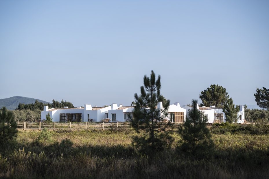 exterior shot over the green landscape up towards craveiral farmhouse in Portugal
