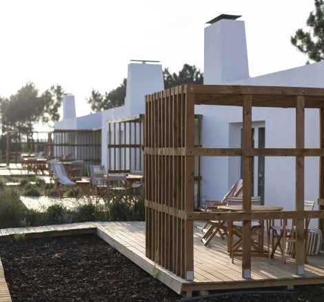 exterior view of rooms and their private decking areas at craveiral farmhouse in portugal