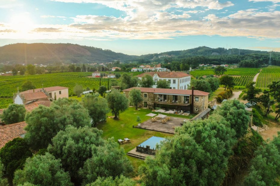 view over the trees towards terra rosa country house and vineyards wedding venue in portugal