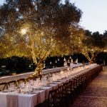 wedding breakfast tables laid up ready for guests at sundown at Son Doblons wedding venue in mallorca spain