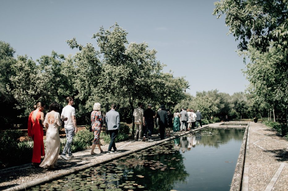 wedding guests walking to the ceremony area at Son Doblons wedding venue in mallorca spain
