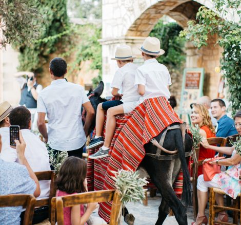 Traditional destination wedding ceremony with a donkey at Grecotel Agreco Farm Crete Greece.