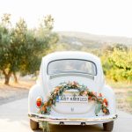 Vintage getaway car for a sunset wedding editorial in Grecotel Agreco Farms Crete Greece as published on Ruffled blog.