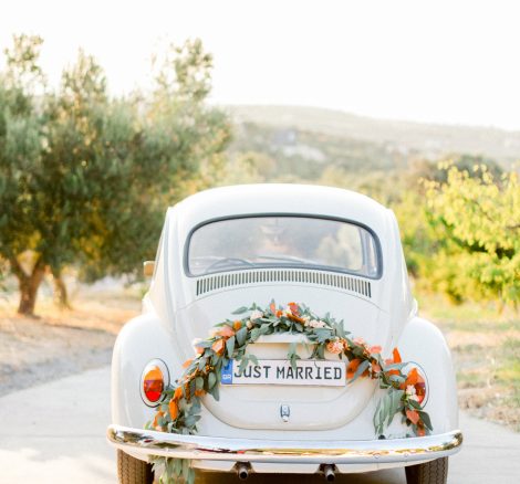 Vintage getaway car for a sunset wedding editorial in Grecotel Agreco Farms Crete Greece as published on Ruffled blog.