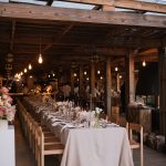 undercover wedding breakfast tables laid up for a wedding at craveiral farmhouse in portugal