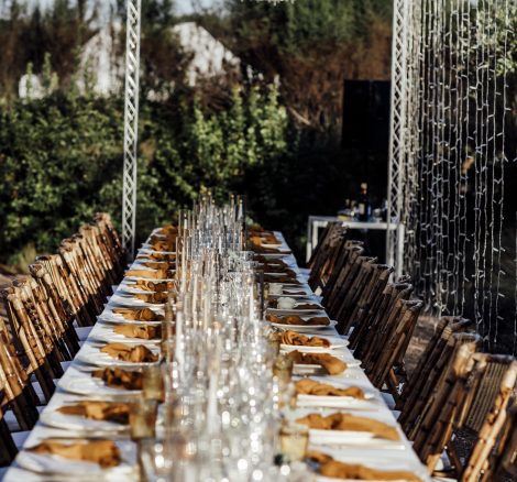 long rectangular wedding breakfast tables laid up ready for guests at unique wedding venue ca na xica in ibiza
