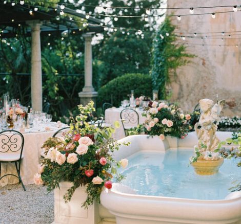 fountain with wedding flower arrangements at villa cipressi Italian wedding venue on lake como