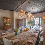 indoor dining room with long rectangular table at spanish wedding venue Masia Victoria