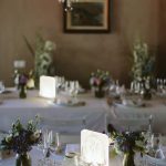 round wedding tables with white linen at spanish wedding venue Masia Victoria