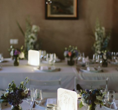 round wedding tables with white linen at spanish wedding venue Masia Victoria