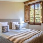 bedroom with wooden shutters at villa Catalina in spain