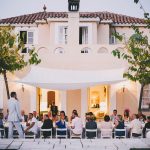 wedding guests dining al fresco outside at masia casa nova sitges wedding venue