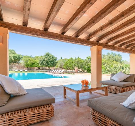 the outside grounds seating area and pool at son doblons spanish wedding venue in mallorca