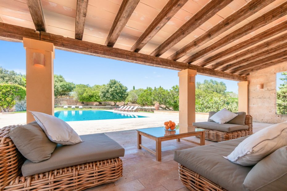 the outside grounds seating area and pool at son doblons spanish wedding venue in mallorca