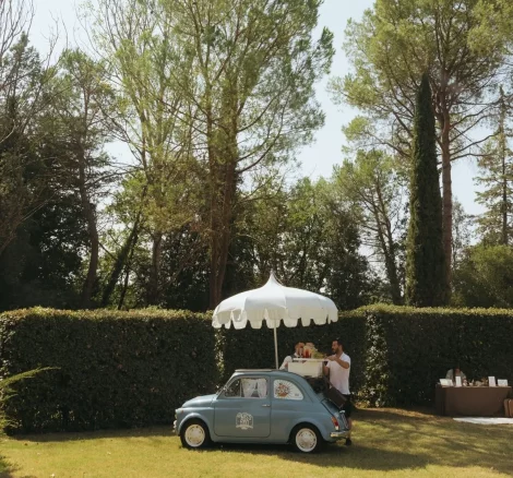 Image of little car with umbrella at wedding venue Castello di San Fabiano