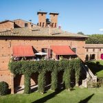terrace area with red canopies at Italian wedding venue Castello di San Fabiano