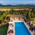 wedding guests surrounding the pool area at Son Doblons wedding venue in mallorca spain