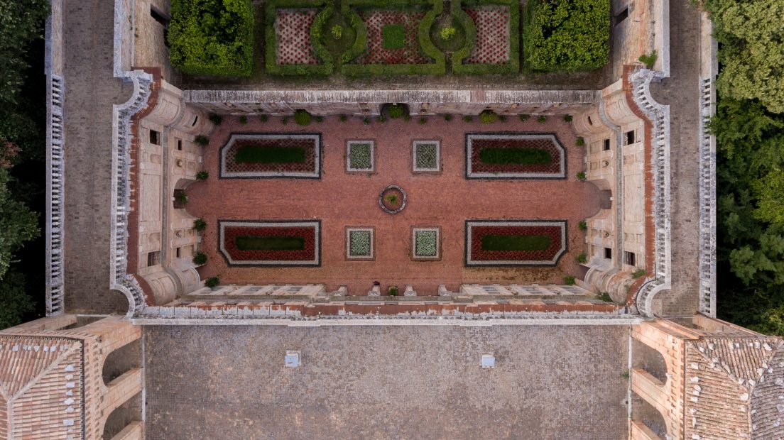Aerial view above courtyard with walled garden at Italian wedding venue