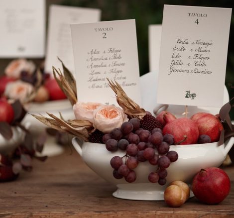 grapes and fruit in bowls with table names at Italian wedding venue convento dell'Annunciata