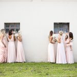 Bridesmaids sneakily looking through the windows at Italian country estate wedding venue