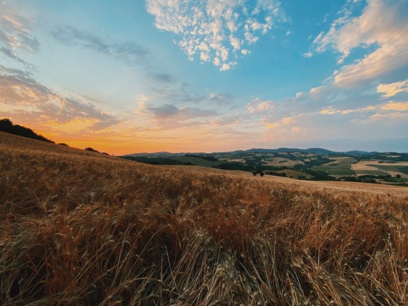 View out over the surrounding hilly landscape during sunset from Italian country house wedding venue Le Stonghe