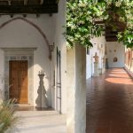 beautiful white walls and wooden doorway at Italian wedding venue convento dell'Annunciata