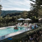 pool area at Italian wedding venue looking out over the surrounding hilly landscape