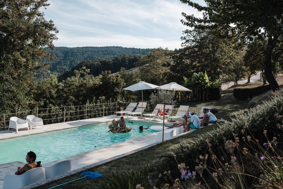 pool area at Italian wedding venue looking out over the surrounding hilly landscape