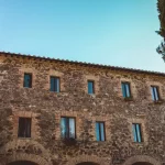 angled shot up towards the ancient walls at Italian wedding venue Antico convento i cappuccini di montalcino