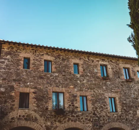 angled shot up towards the ancient walls at Italian wedding venue Antico convento i cappuccini di montalcino
